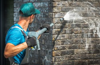 Chris Normile Roofing pressure washing service in Olney